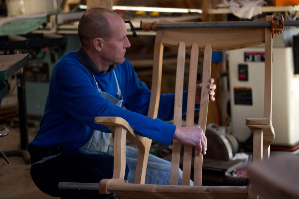 Robert Bragg assembling his handcrafted hardwood rocking chairs