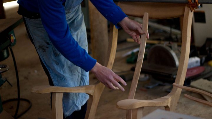 Assembling Black Slats onto Handcrafted Hardwood Ergonomic Rocking Chair