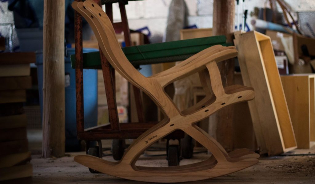 Ergonomic rocking chair frame with wood burned signature